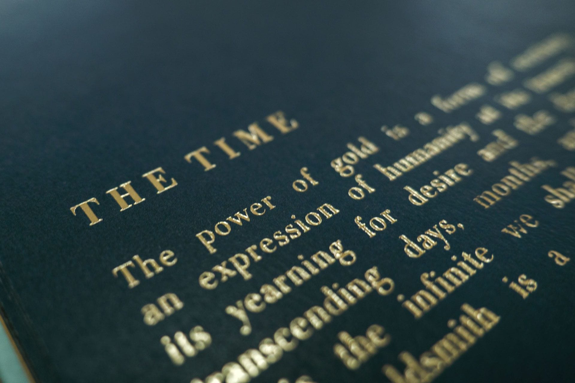 The opening page of the chapter The Time, gold lettering on dark blue paper